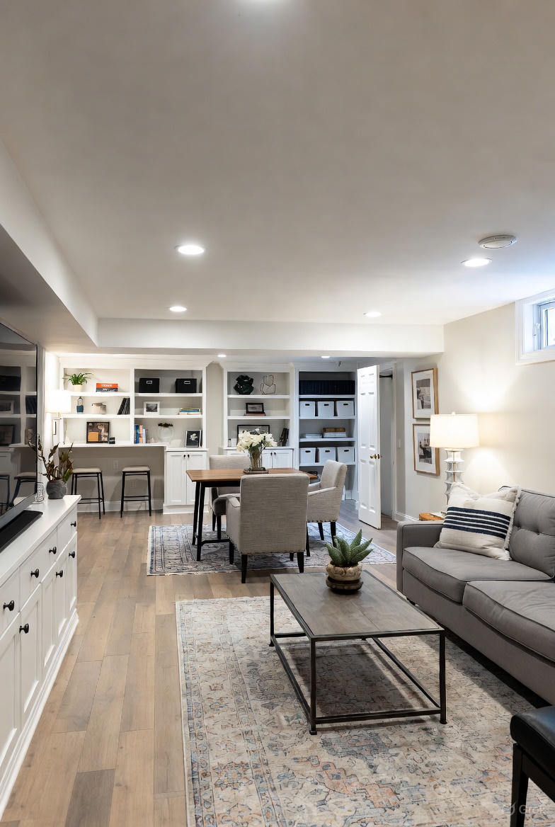 Basement after renovation - open concept living space with built-ins